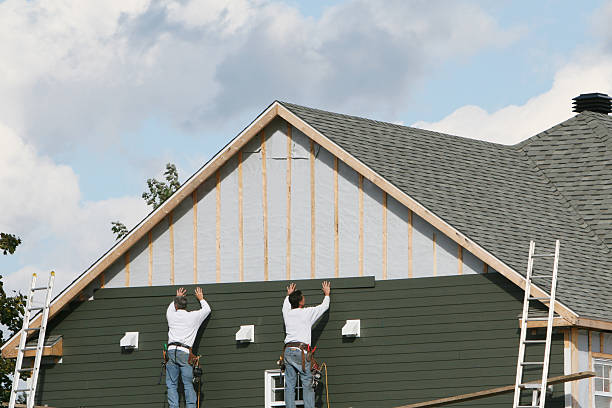 Professional Siding Installation technician working in Louviers, CO